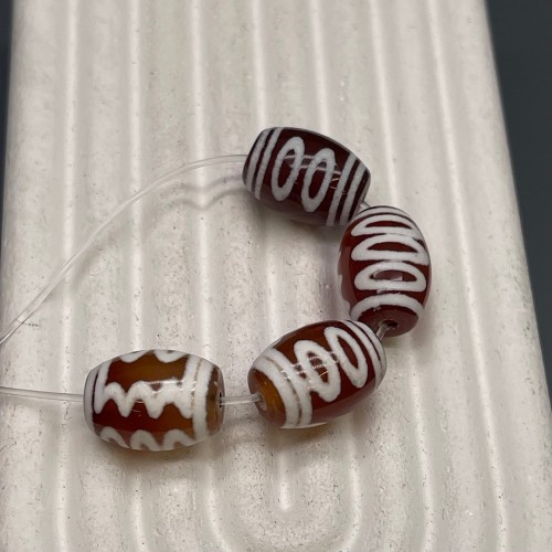 Бусина Дзи "781" из сердолика, 5 глаз, размер 12х9 мм