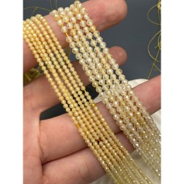 Каменные бусины, Цирконий кубический, (т.н. Циркон), кристалл, цвет "айвори" (слоновая кость), шарик огранка, 2 мм, длина нити 38 см