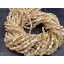 Каменные бусины, Перламутр бежевый, тонированный, рис, 5х8 мм, длина нити 38 см