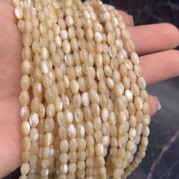 Каменные бусины, Перламутр бежевый, тонированный, рис, 5х8 мм, длина нити 38 см